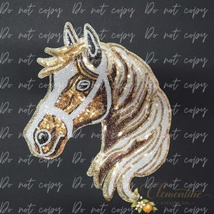 May include: A decorative horse head patch featuring gold and white sequins. The design includes a white bridle detail, a flowing mane, and a dark eye. The horse is rendered in a profile view with shimmering metallic textures throughout the piece.