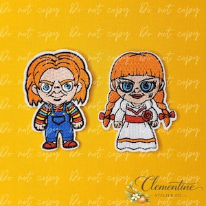 May include: Two embroidered patches featuring cartoon-style characters. The left patch depicts a figure with orange hair, blue eyes, and blue overalls over a striped shirt. The right patch shows a figure with orange braided hair, blue eyes, and a white dress.