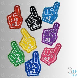 Puede incluir: Parches de dedos de espuma de varios colores, incluyendo rojo, negro, azul, verde, amarillo, morado y rosa. Cada parche muestra el número "#1" en blanco y un contorno brillante, ideal para eventos deportivos.