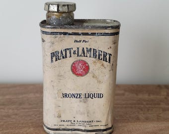 Lata vintage de Pratt & Lambert de bronce para líquido de media pinta con contenido. Publicidad industrial.