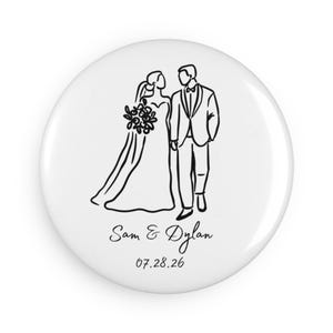 May include: White button with a black line drawing of a bride and groom. The bride is wearing a wedding dress and holding a bouquet. The groom is in a tuxedo. The names "Sam & Dylan" and the date "07.28.26" are printed below.