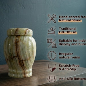 May include: A light green stone urn with brown natural veining and a lift-off lid. Text on the right lists features: Hand-carved from Natural Stone, Traditional Lift-Off Lid, Suitable for indoor display and burial, Irregular natural veins, Scratch-Free & Anti-Slip, and Anti-Slip Bottom.