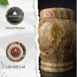 May include: A cylindrical green and brown stone urn with a polished finish and a lift-off lid. Two circular insets show a black silicon bottom with the text MEMORIAM eternal love and a top view of the lid with a matching logo and text.