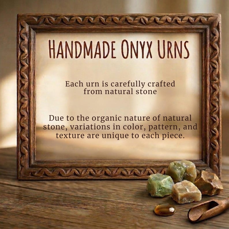 May include: A rectangular wooden frame with a carved border containing text that reads: HANDMADE ONYX URNS. Each urn is carefully crafted from natural stone. Due to the organic nature of natural stone, variations in color, pattern, and texture are unique.