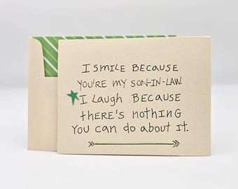 May include: A beige card with green accents and a handwritten message that reads: "I smile because you're my son-in-law. I laugh because there's nothing you can do about it."