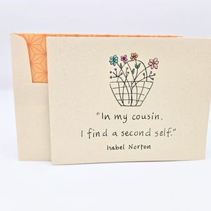 May include: A card with a hand-drawn illustration of a basket of flowers. The card reads "In my cousin, I find a second self."  - Isabel Norton