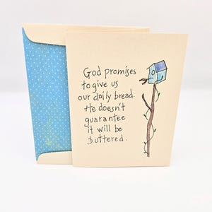 May include: A card with a blue birdhouse illustration and the text "God promises to give us our daily bread. He doesn't guarantee it will be buttered."