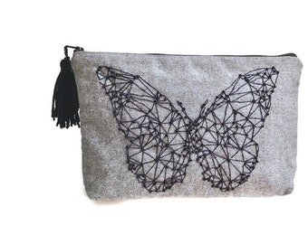 Web butterfly canvas pouch, hand embroidered with black beads, black tassel detailing