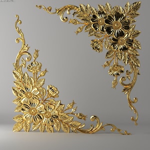 May include: Two ornate, gold-colored floral corner decorations. Each corner features detailed flowers, leaves, and scrolling vines. The design is symmetrical, with the floral elements arranged to create a decorative border.