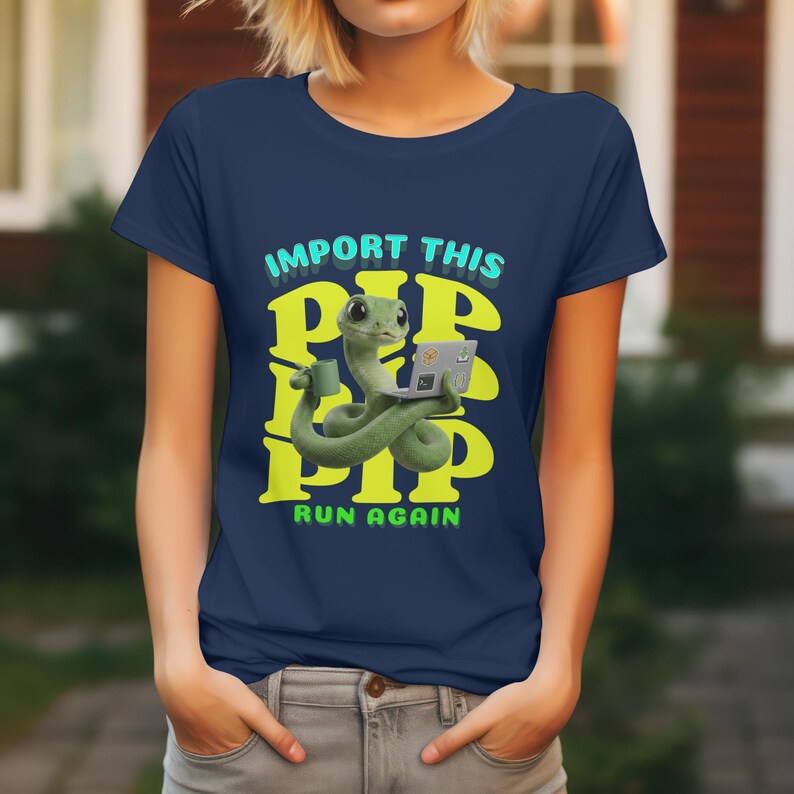 May include: Navy blue t-shirt with a cartoon snake using a laptop and holding a coffee cup. The text "IMPORT THIS PIP PIP PIP RUN AGAIN" is in yellow and teal. A quirky graphic tee.