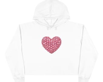 Sudadera corta rosa con capucha en forma de corazón de diamante.
