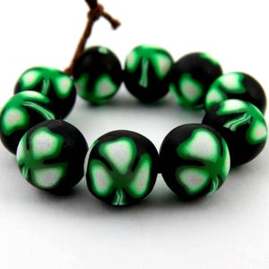 shamrock leaf beads/ round beads/ green beads/ leaf beads/ clover leaf beads/ jewelry supplies/ green and black/ handmade beads