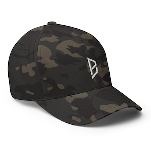 May include: A camouflage baseball cap with a curved brim. The cap features a white embroidered "B" logo on the front. The hat is made of a durable fabric and has a classic six-panel design.