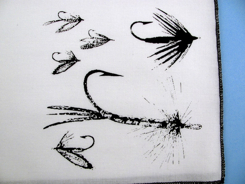 May include: Black and white illustration of five different fly fishing lures. The lures are drawn in a realistic style and feature intricate details.