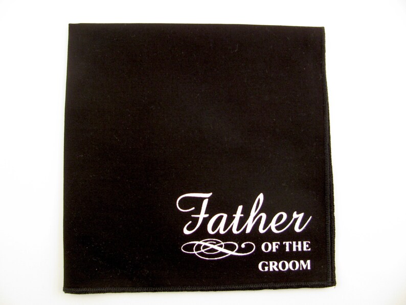 May include: Black pocket square with white text that reads "Father of the Groom".