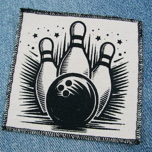 May include: A set of three ceramic mugs with a speckled, cream-colored glaze. Each mug features a different hand-painted design: a blue and green leaf, a yellow flower, and a red berry. The mugs have a simple, rounded shape and a comfortable handle.