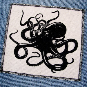 May include: Black and white embroidered patch of an octopus with its tentacles curled around itself. The patch is on a white background and has a black stitched border.