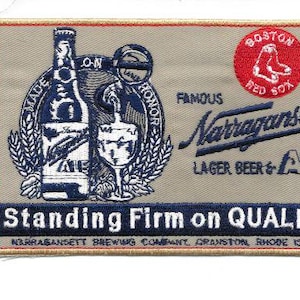 May include: Embroidered patch with a beer bottle, glass, and "Narragansett Lager Beer & Ale" text. Includes a red circle with the Boston Red Sox logo. The patch reads "Standing Firm on Quality."