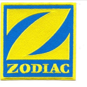 May include: A square embroidered patch featuring a yellow stylized letter Z on a blue background with the word ZODIAC in yellow capital letters below. A ruler is visible on the left side, showing the patch height is approximately 3.5 inches.