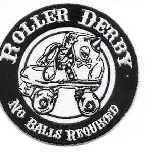 May include: A round, black and white patch with the words "ROLLER DERBY" and "NO BALLS REQUIRED" encircling a roller skate graphic. The skate has a skull and crossbones design. The patch is approximately 3 inches in diameter.