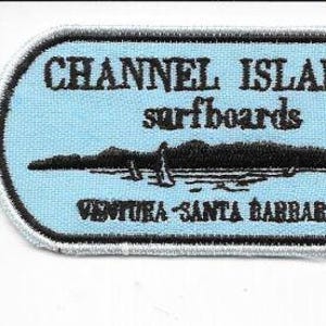 May include: A light blue patch with black text and a black graphic of a shoreline. The text reads "CHANNEL ISLANDS surfboards VENTURA - SANTA BARBARA". The patch has a white border and is rectangular with rounded corners.