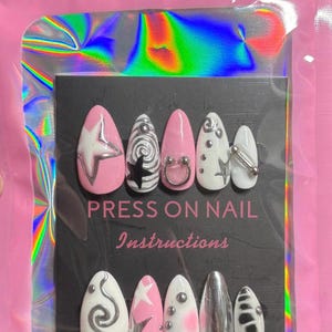 Uñas postizas con forma de estrella cromada en rosa y blanco