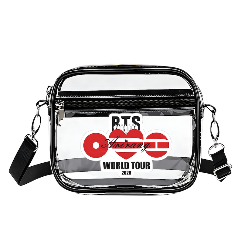 May include: Clear crossbody bag with black trim and a black adjustable strap. The bag features a graphic with the text "BTS Arirang WORLD TOUR 2026" in red and white.