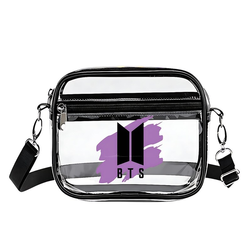 May include: Clear crossbody bag with black trim and a black adjustable strap. The bag features a purple and black graphic with the letters "BTS" printed in white.
