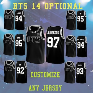 May include: Black basketball jerseys with white trim and player numbers. The jerseys feature the text "BTS" and various player names and numbers, including "J-Hope 94", "Jimin 95", and "Jungkook 97". The text "Customize Any Jersey" is also visible.