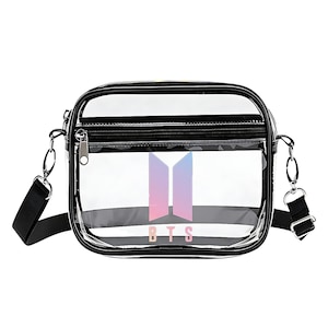 May include: Clear crossbody bag with a black trim and a black adjustable strap. The bag features a front zippered pocket and a BTS logo in shades of pink, purple, and blue.