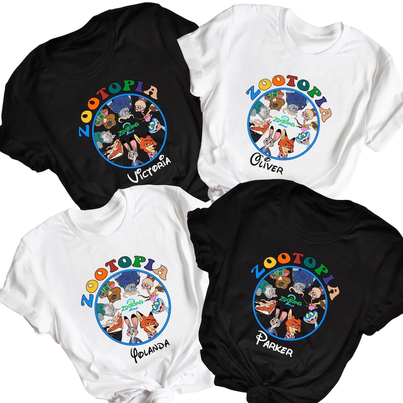 May include: Four short-sleeved t-shirts, two black and two white, each featuring a colorful "Zootopia" graphic. The graphic includes various cartoon characters and the name of a person. The shirts are made of a soft material.