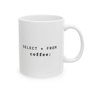 May include: White ceramic coffee mug with a curved handle. The mug features the text "SELECT * FROM coffee;" in black, a humorous reference to a database query. The mug is designed for hot beverages.