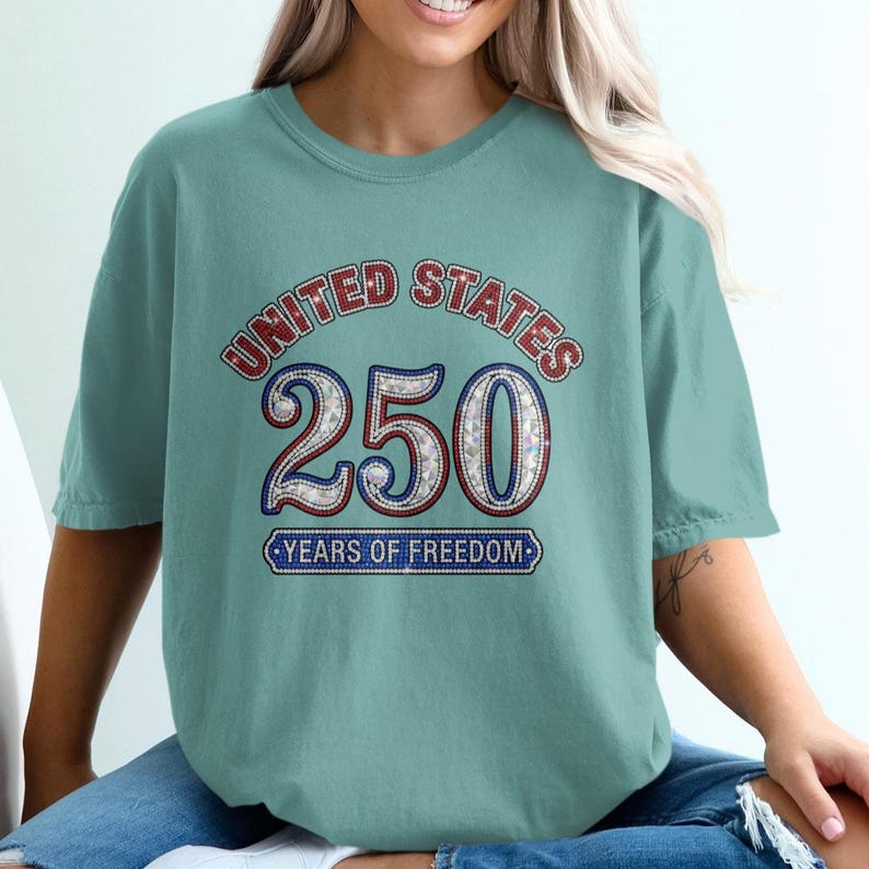 Teal t-shirt with "United States 250 Years of Freedom" text and stars.