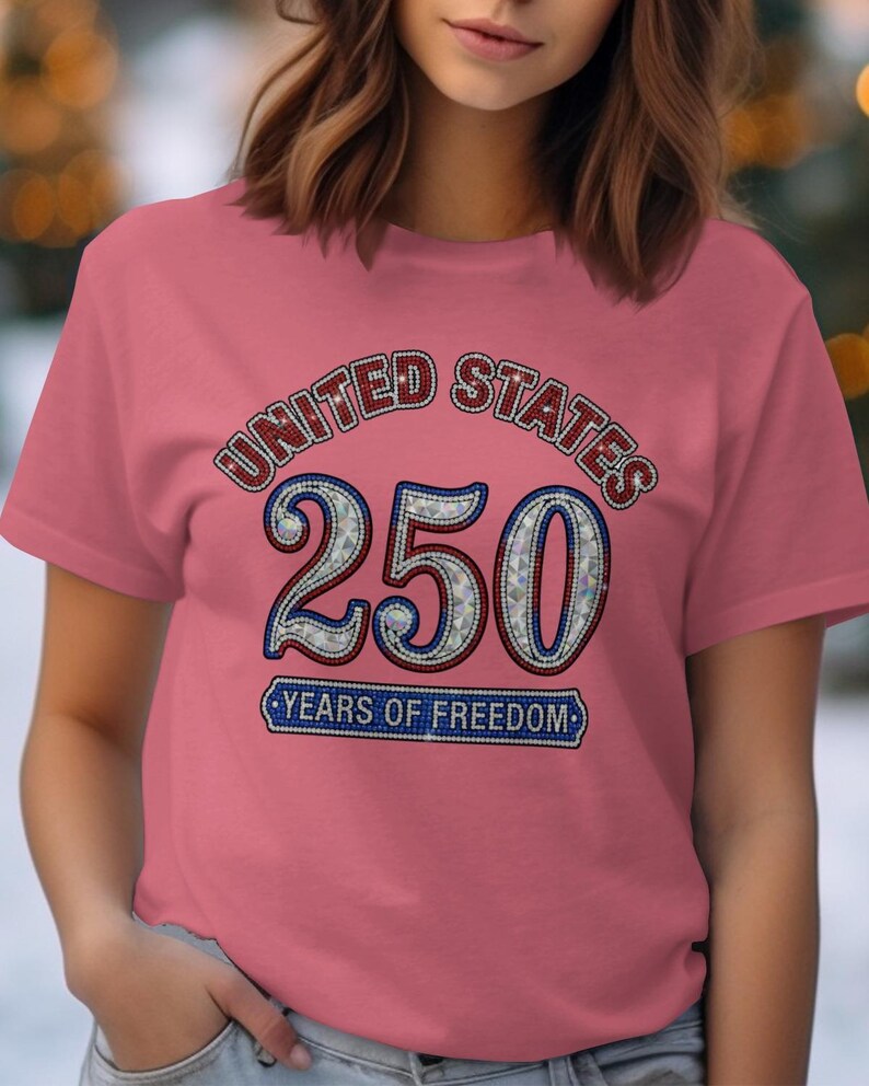 Pink t-shirt with "UNITED STATES 250 YEARS OF FREEDOM" design.