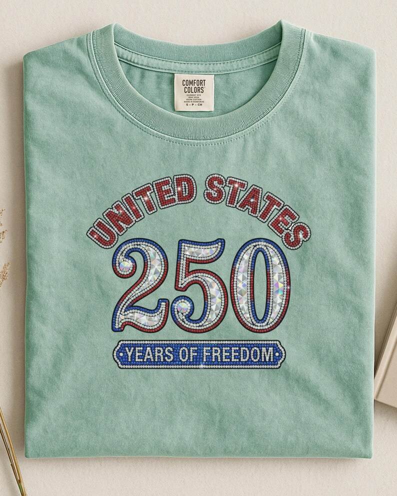 Green t-shirt with "United States 250 Years of Freedom" graphic.