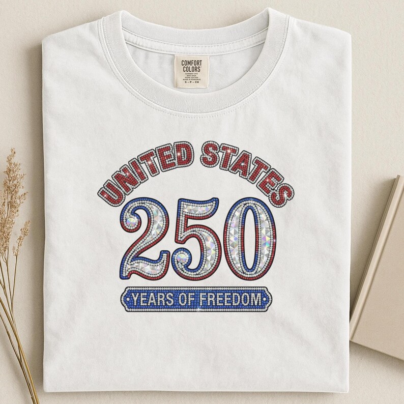 White t-shirt with "United States 250 Years of Freedom" graphic.