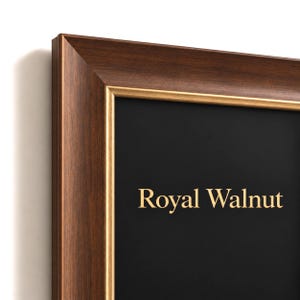 May include: A rectangular picture frame with a dark brown wood grain finish and a thin gold inner border. The frame surrounds a solid black background featuring the text Royal Walnut in a gold serif font centered in the middle.