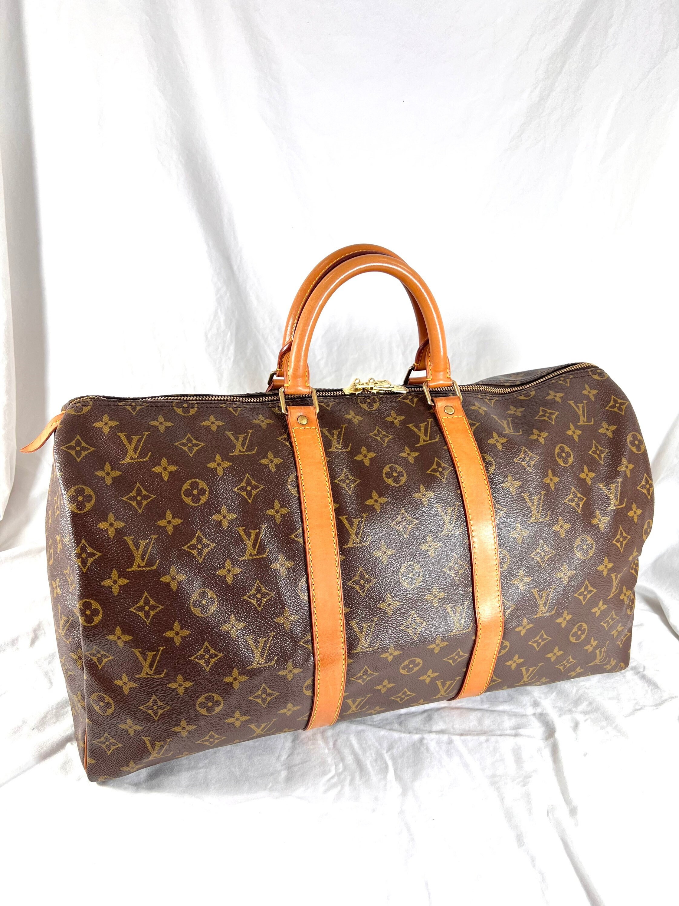 Louis Vuitton Keepall Duffle Bag in Brown and Tan Monogram Coated Canvas -  Rafael Osona Auctions Nantucket, MA