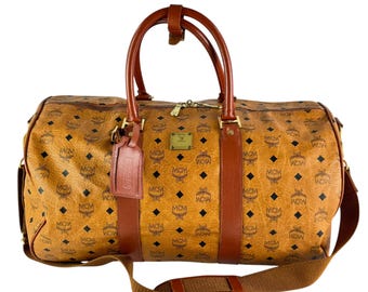 90 年代の本物のブラック MCM ハンドバッグ（エンボスロゴ付き）|高級