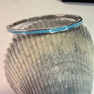 May include: A rustic wooden sign with the text "Welcome to our home" in a handwritten style. The sign features a distressed finish and a simple, inviting design, perfect for a front porch or entryway.