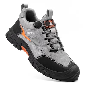 May include: Grey and black hiking shoe with orange detailing. The shoe has a robust sole, grey laces, and the text "C.MEIDAI.Z" and "MEIDAI". Designed for outdoor activities, it features a sturdy construction.