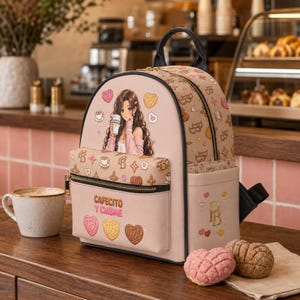 May include: A beige backpack featuring an anime-style illustration of a person holding a coffee cup, surrounded by heart and bread icons. The front pocket displays the text "CAFECITO Y CHISME" with a repeating pattern of letters and hearts.