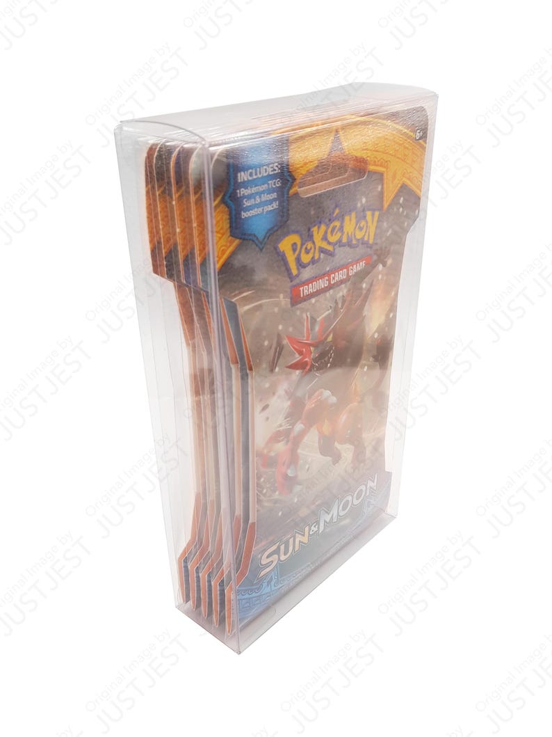 May include: A clear plastic case containing multiple Pok&eacute;mon TCG Sun & Moon booster packs. The packs feature the Pok&eacute;mon logo and artwork of a red and orange creature. The case includes a sticker that says "Includes: 1 Pok&eacute;mon TCG Sun & Moon booster pack!"