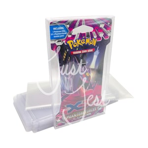 May include: A clear plastic card holder containing a Pokémon Trading Card Game booster pack. The pack features the "Phantom Forces" design with the Pokémon logo and the text "Trading Card Game". The holder is designed to protect the cards.