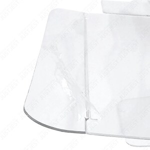 May include: A clear, transparent plastic object with a curved edge and multiple flat surfaces. The object appears to be folded or constructed from several pieces, with visible seams and a slightly reflective quality. The overall shape is geometric.