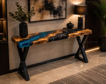 Mesa consola de resina azul océano con vetas de madera, mesa de entrada de mármol negro con borde natural.