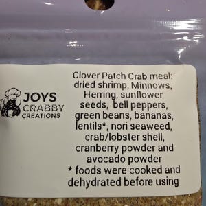 May include: A package of Clover Patch Crab meal by Joys Crabby Creations. The ingredients include dried shrimp, minnows, herring, sunflower seeds, bell peppers, green beans, bananas, lentils, nori seaweed, crab/lobster shell, cranberry powder, and avocado powder.