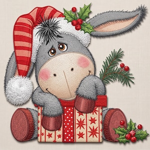 May include: An embroidered design of a gray donkey wearing a red and white striped Santa hat, sitting inside a gift box decorated with red stars. The donkey has pink cheeks, brown eyes, and is holding a sprig of green holly with red berries.