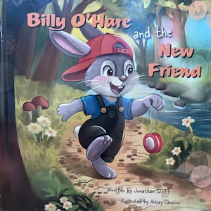 May include: A children's book cover titled Billy O'Hare and the New Friend, featuring a gray rabbit wearing a red baseball cap and black overalls, holding a red yo-yo while walking on a forest path near a stream, written by Jonathan Scott.