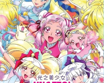 Puede incluir: Una carátula de DVD con una ilustración anime de varios personajes con cabello y atuendos coloridos. El texto dice: HUGTTO! PRECURE HUG! VOL. 1-49 END + MOVIE: FUTARI WA PRECURE ALL STARS MEMORIES. El diseño incluye acentos brillantes en rosa, azul y amarillo.